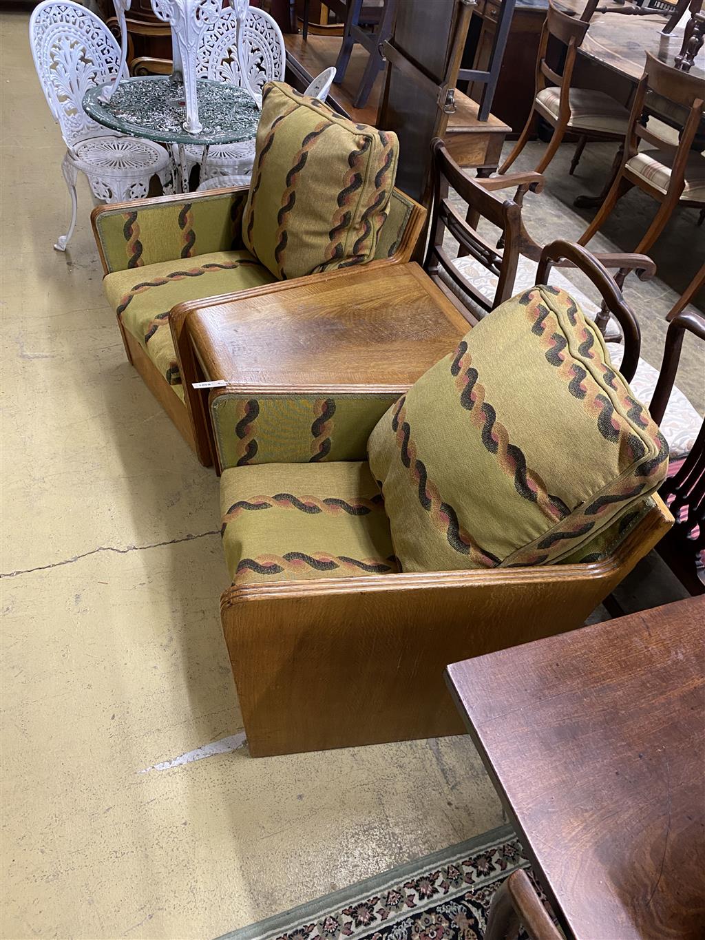 An Art Deco oak three section conversation seat, possibly with its original upholstery, width 170cm, depth 70cm, height 71cm